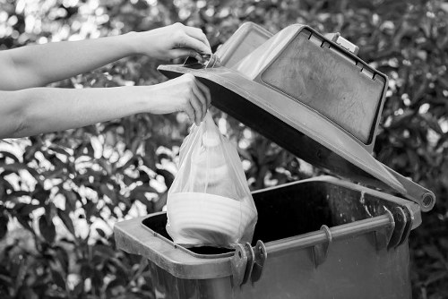 Waste collection trucks servicing commercial areas